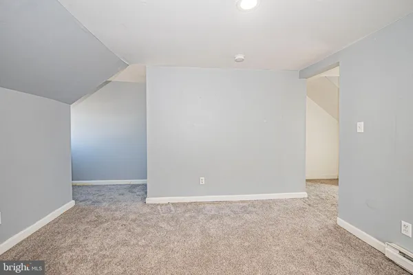 a view of a room with wooden walls