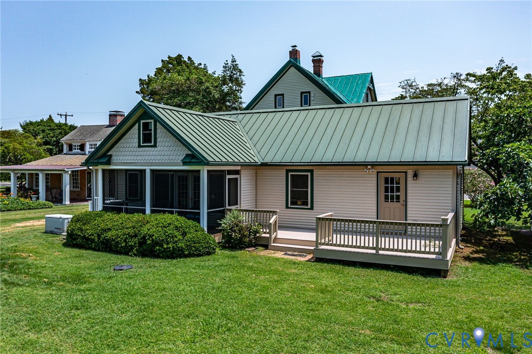 618 Main Street Reedville, VA 22539 - Photo 39 of 54 Rear exterior featuring a screened porch, an eleva
