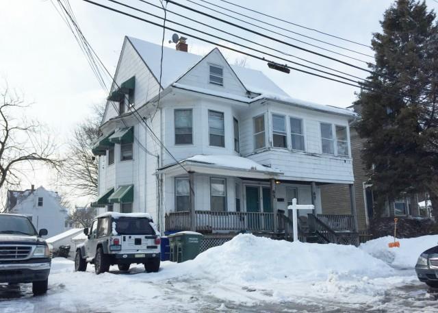 67 Fox Street Bridgeport, CT 06605 - Photo 1 of 1 a view of a building with a yard covered in snow