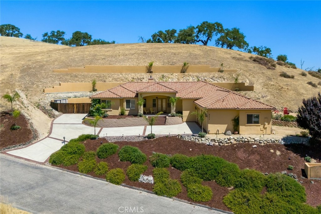a view of a house with outdoor space and sitting area