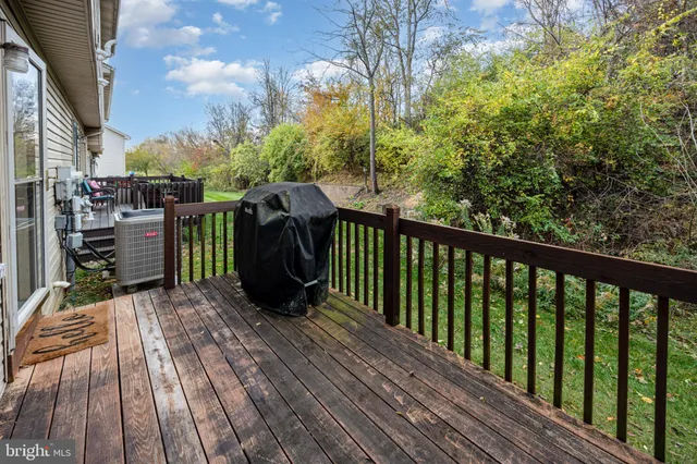 a view of a balcony with wooden floor
