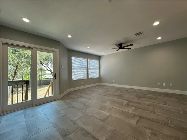a view of an empty room with a window