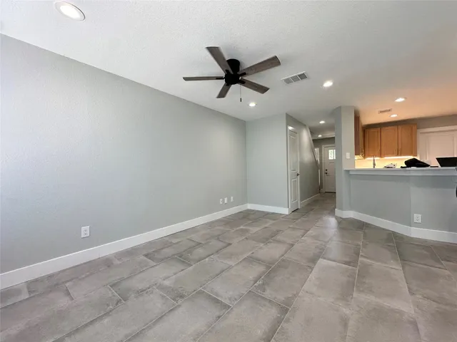 a view of a kitchen with a sink and cabinets