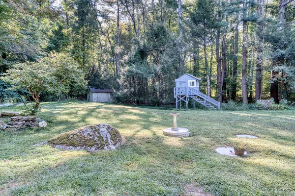 a backyard of a house with lots of green space