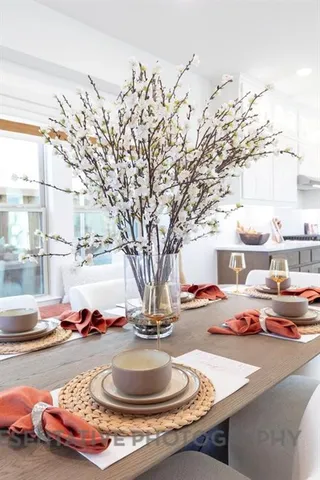 a view of living room with furniture and a potted plant