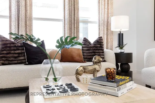 a patio with table and chairs and potted plants