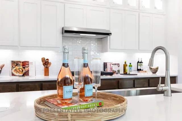 a dining table with kitchen view