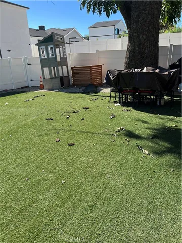 a view of front of house with a yard