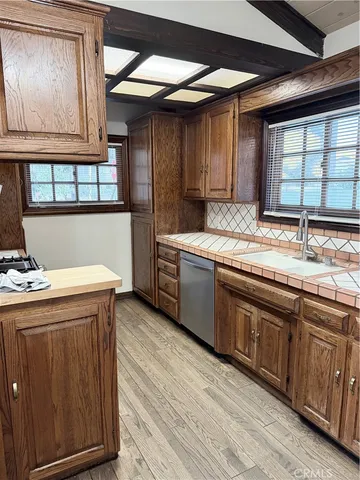 a view of an empty room and wooden floor