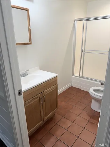 a bathroom with a sink vanity and a mirror