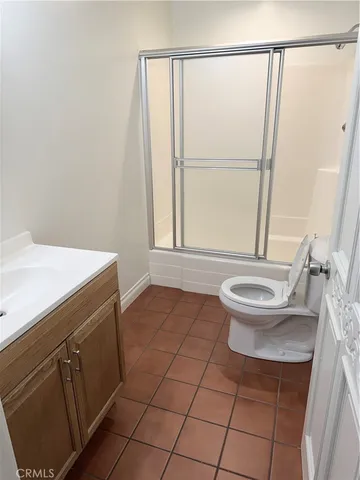 a view of a room with wooden floor and window