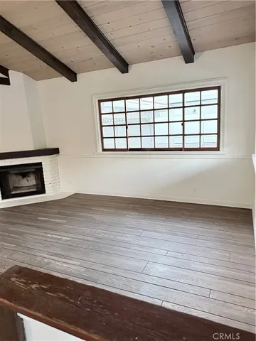a kitchen with granite countertop wooden cabinets a sink and dishwasher