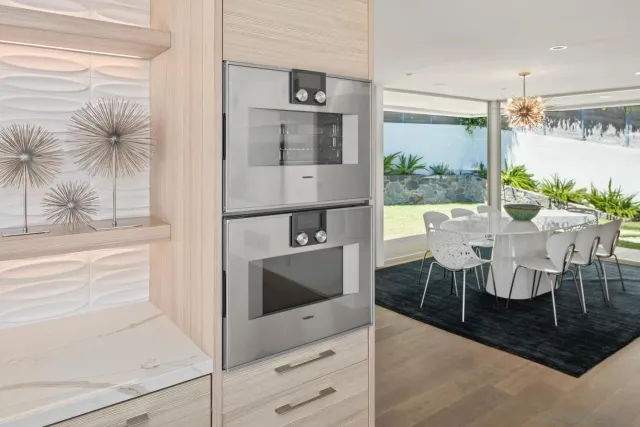 a view of kitchen with dining table and chairs