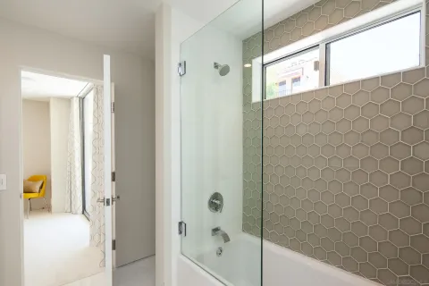 a bed room with a bed and a chair