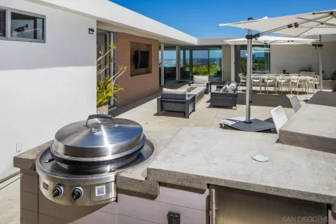 a living room with furniture and flat screen tv