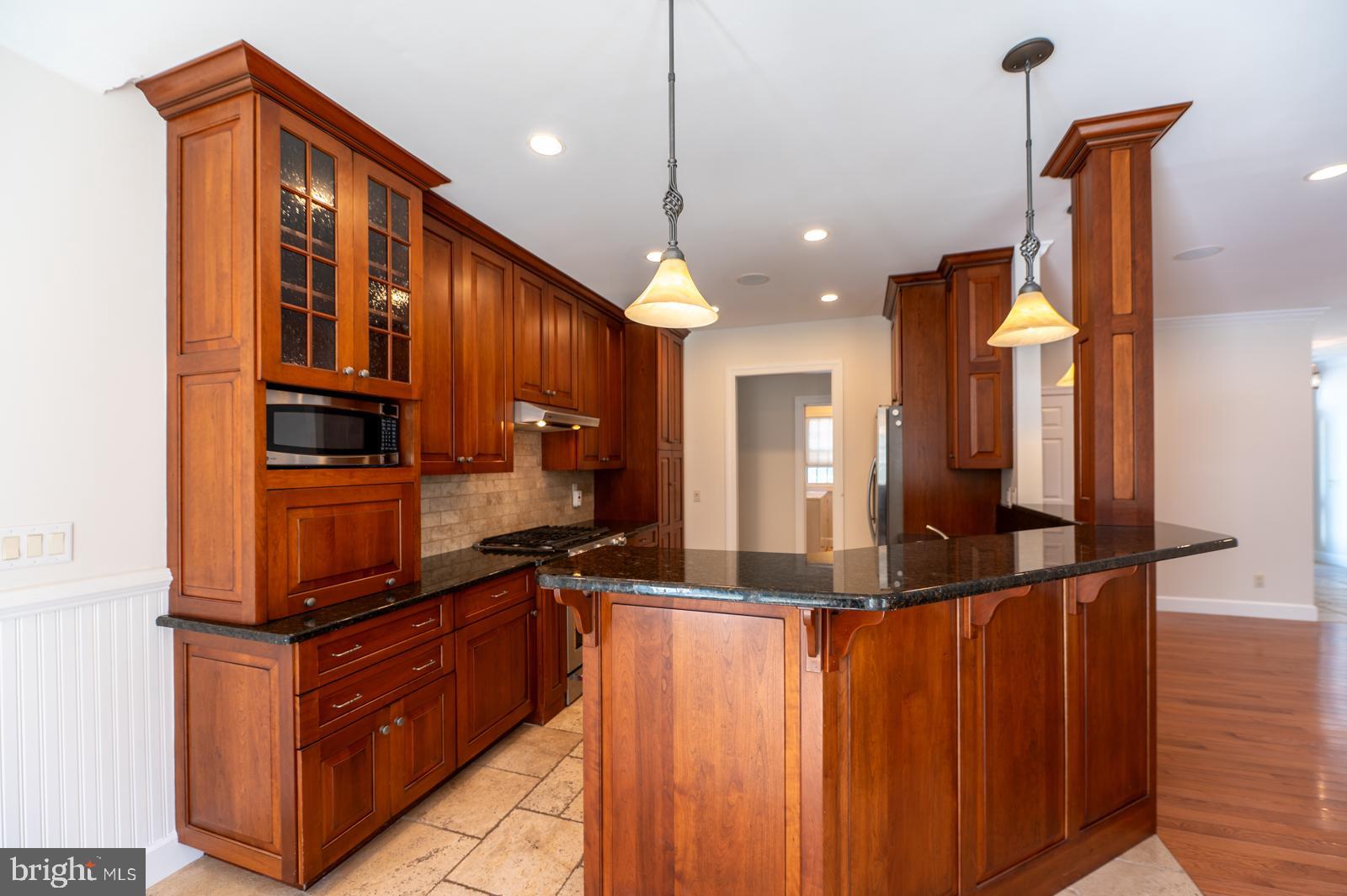 1060 West King Road Malvern, PA 19355 - Photo 17 of 90 a kitchen with stainless steel appliances granite countertop a sink and a refrigerator