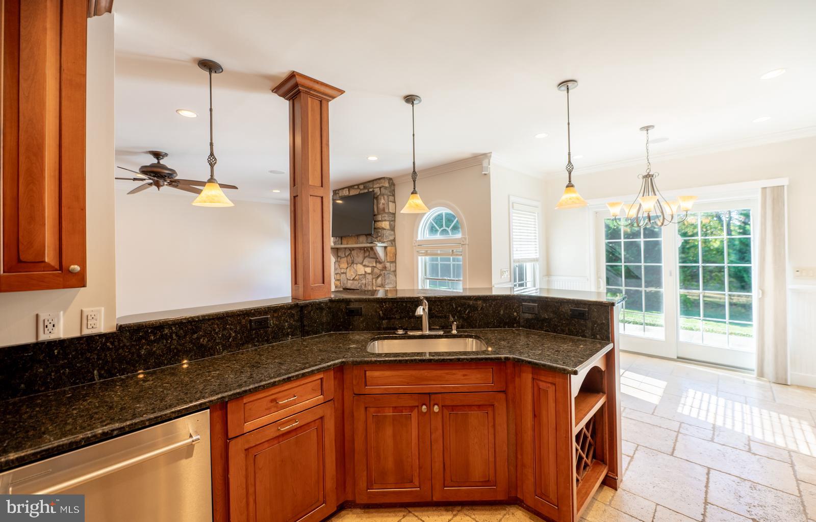 1060 West King Road Malvern, PA 19355 - Photo 19 of 90 a kitchen with stainless steel appliances granite countertop a sink a stove and a wooden floors