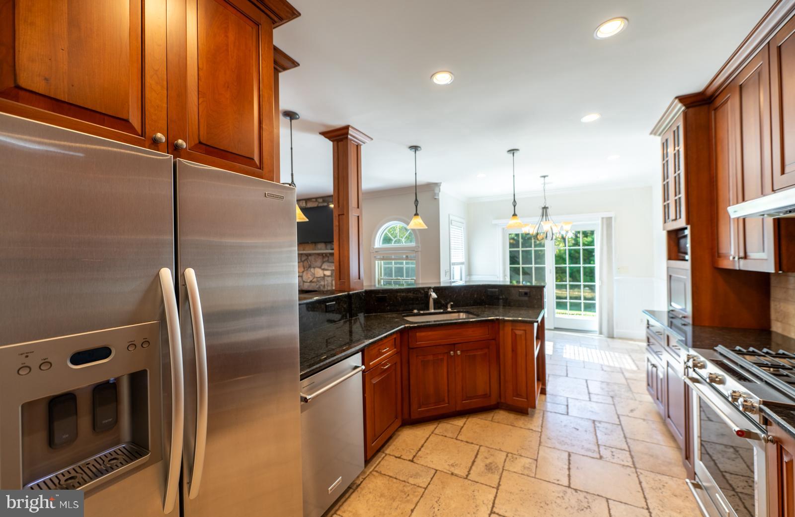 1060 West King Road Malvern, PA 19355 - Photo 26 of 90 a kitchen with stainless steel appliances granite countertop a sink a stove and a refrigerator