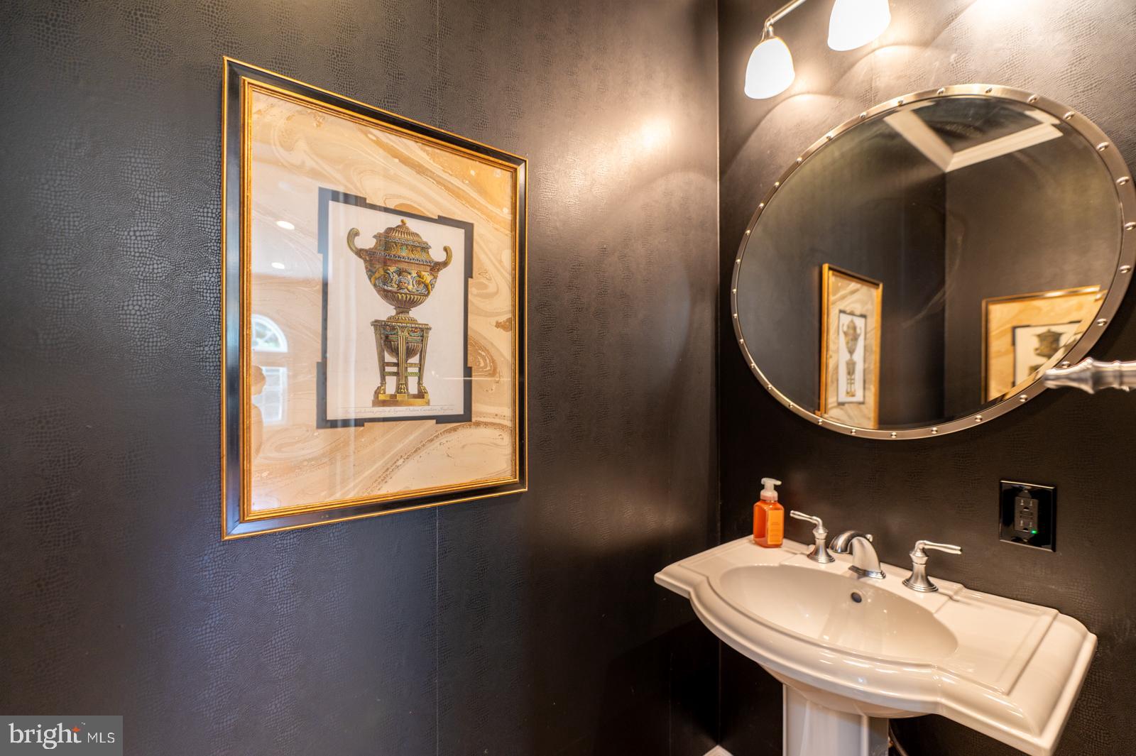 1060 West King Road Malvern, PA 19355 - Photo 28 of 90 a bathroom with a sink and a mirror