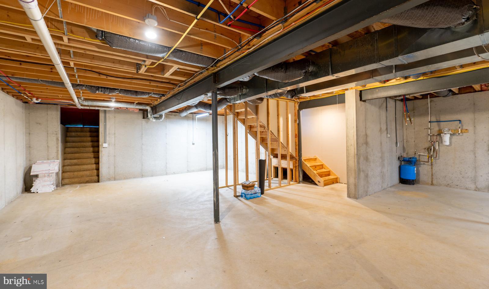 1060 West King Road Malvern, PA 19355 - Photo 65 of 90 a view of an empty room with wooden floor and stairs