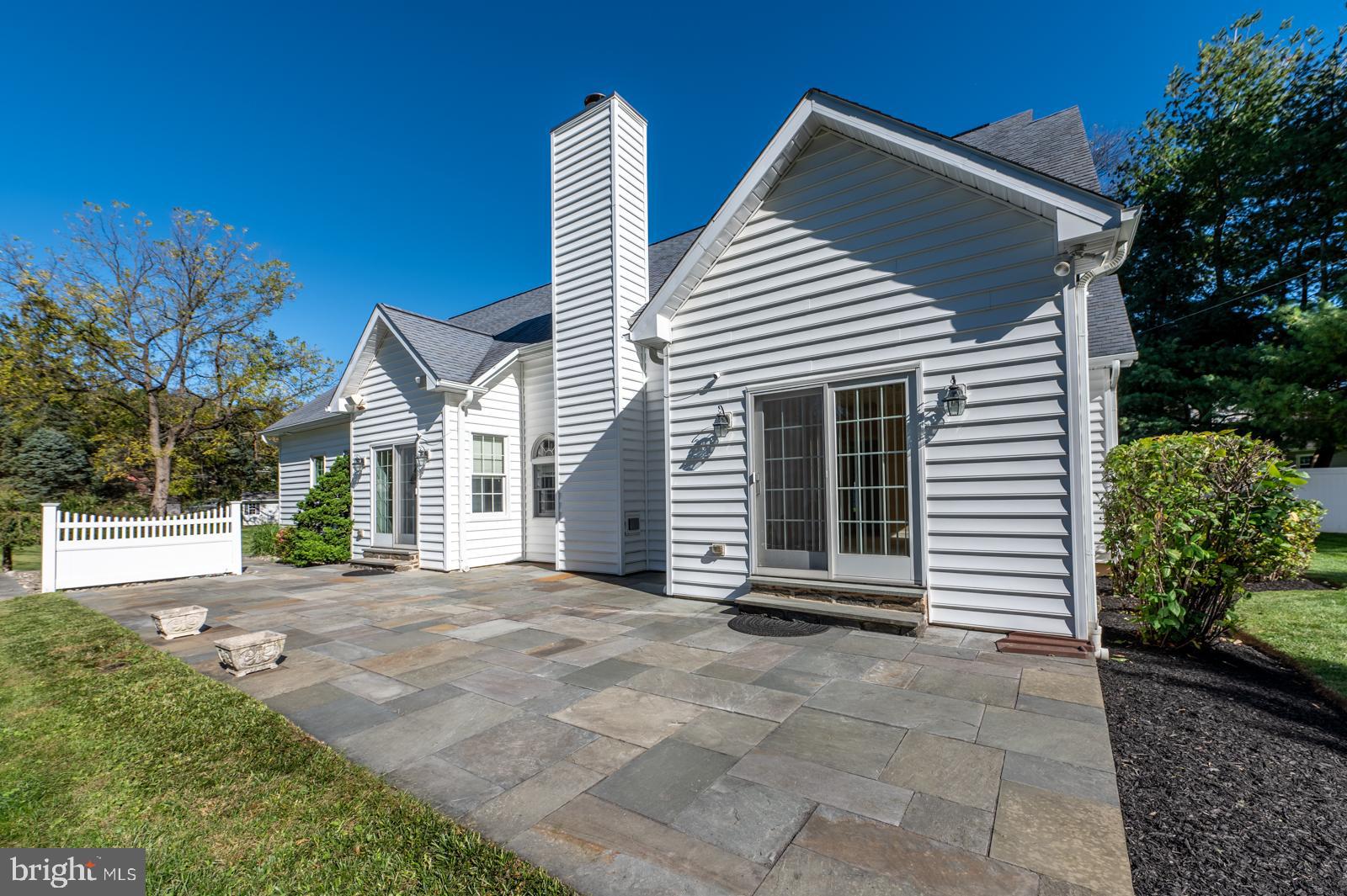 1060 West King Road Malvern, PA 19355 - Photo 81 of 90 a view of a house with a yard and potted plants