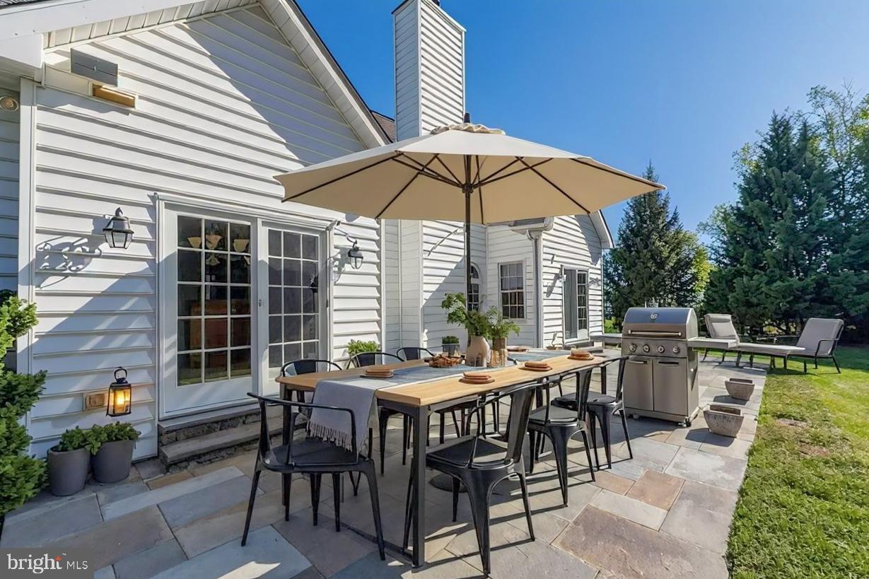 1060 West King Road Malvern, PA 19355 - Photo 83 of 90 a view of a dinning table and chairs in the patio