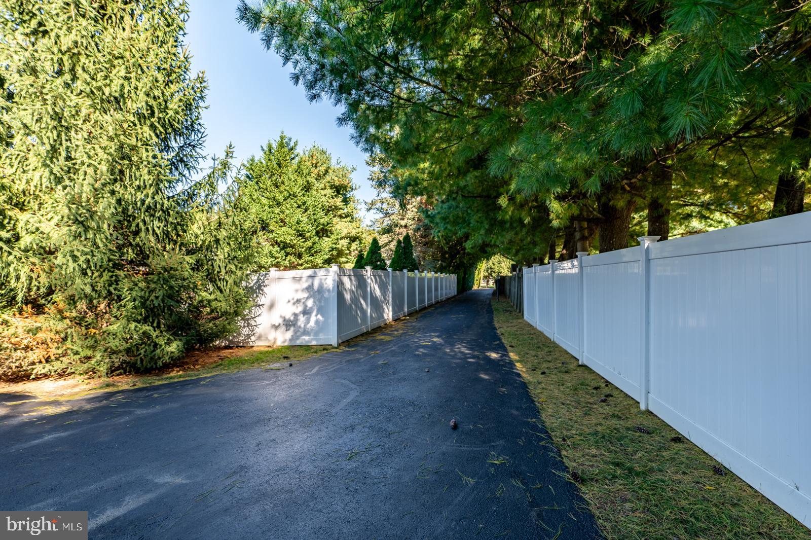 1060 West King Road Malvern, PA 19355 - Photo 90 of 90 a backyard of a house with lots of green space
