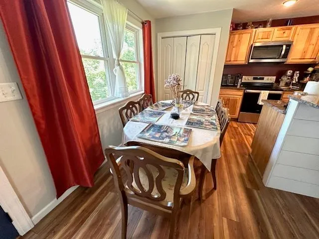 a view of a dining room with furniture window and outside view