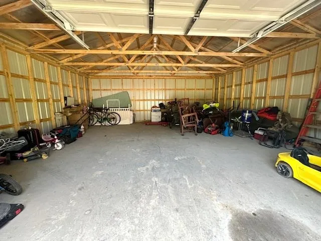a view of a garage with a table and a couch