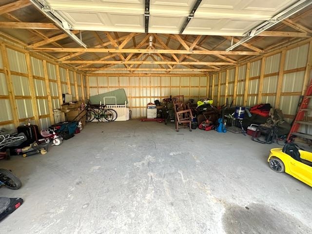 2082 Airport Ridge Road Linden, TN 37096 - Photo 27 of 29 a view of a garage with a table and a couch
