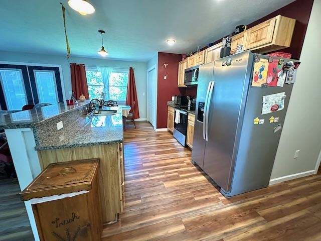 2082 Airport Ridge Road Linden, TN 37096 - Photo 6 of 29 a kitchen with stainless steel appliances granite countertop a refrigerator a stove and a wooden floors