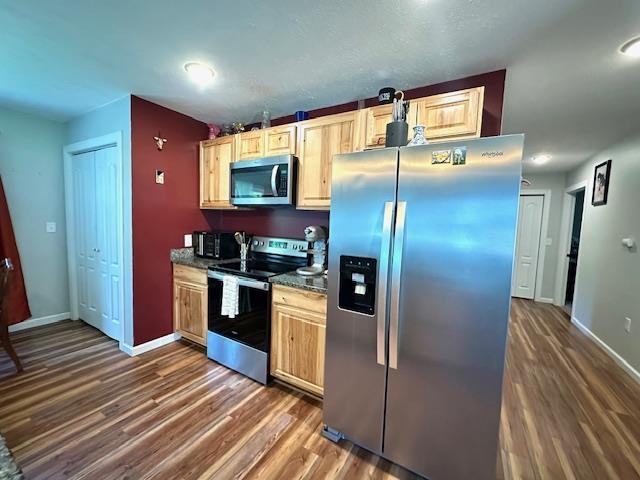 2082 Airport Ridge Road Linden, TN 37096 - Photo 8 of 29 a kitchen with stainless steel appliances kitchen island granite countertop a refrigerator and a sink