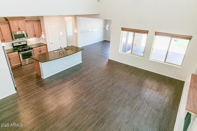 a living room with hard wood floors