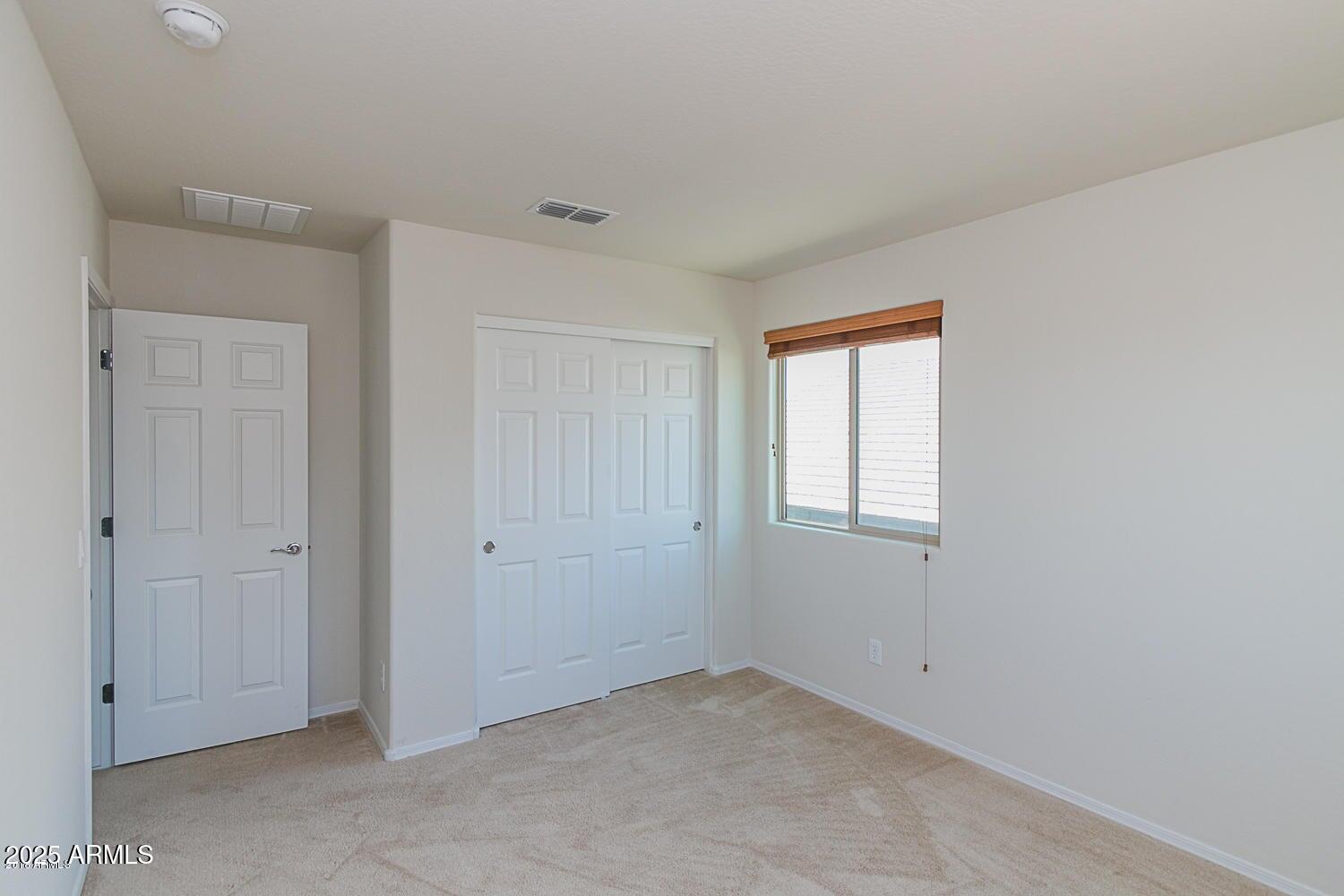 26833 North 14th Lane Phoenix, AZ 85085 - Photo 27 of 55 a view of an empty room with a window