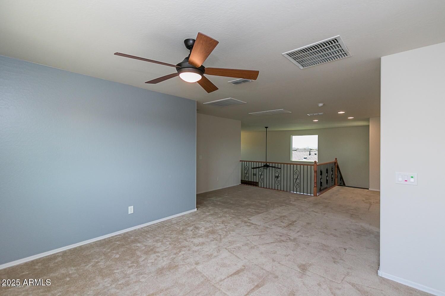 26833 North 14th Lane Phoenix, AZ 85085 - Photo 30 of 55 a view of a livingroom with a ceiling fan and window