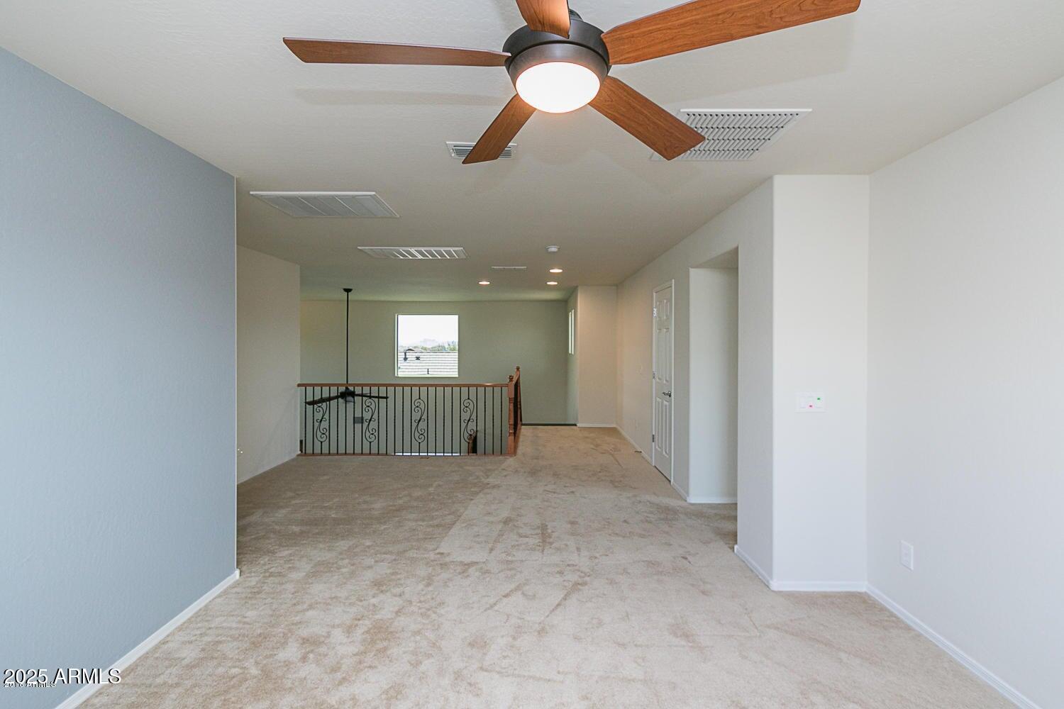 26833 North 14th Lane Phoenix, AZ 85085 - Photo 32 of 55 an empty room with chandelier fan and windows