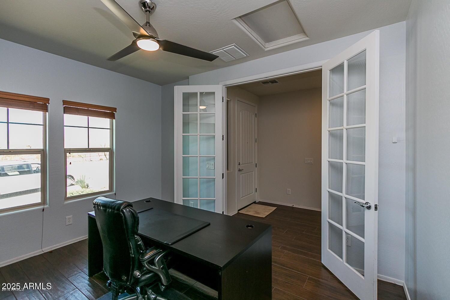 26833 North 14th Lane Phoenix, AZ 85085 - Photo 34 of 55 a view of a workspace with furniture and a window