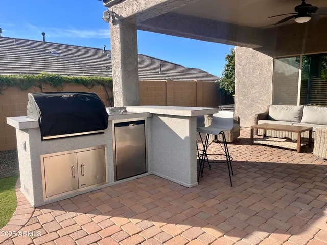 a view of a chairs and table in the patio