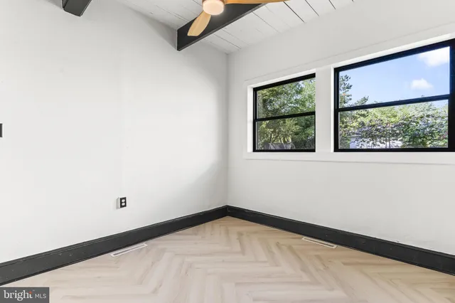 a view of a room that has a window in it