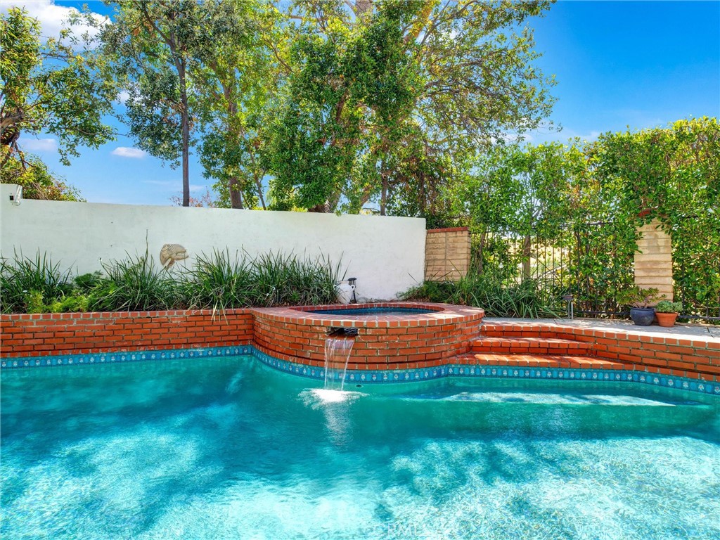 19238 Castlebay Lane Porter Ranch, CA 91326 - Photo 30 of 38 a view of swimming pool with an outdoor space and seating area