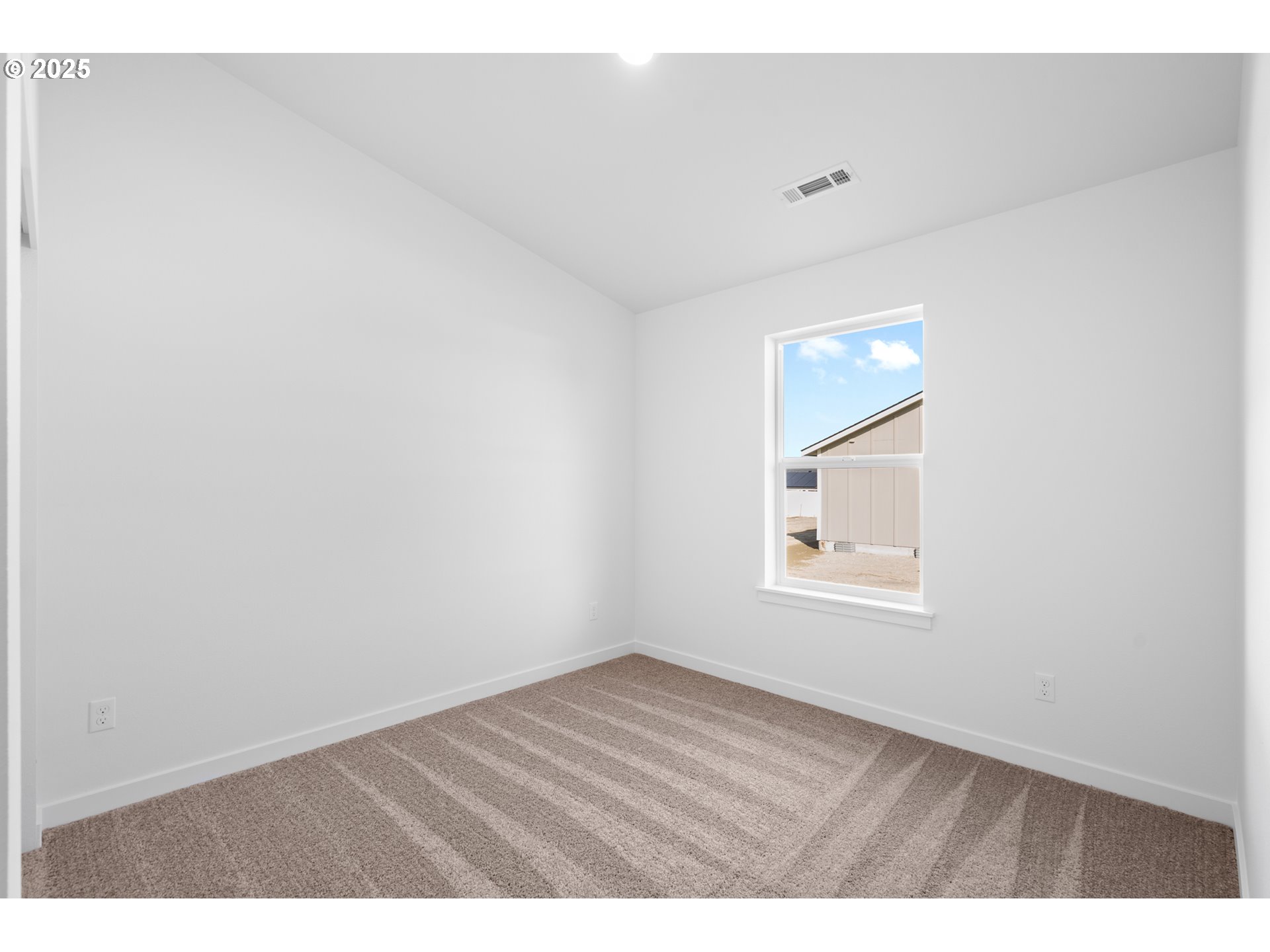 148 Southwest Eagle Drive Boardman, OR 97818 - Photo 18 of 27 an empty room with wooden floor and windows