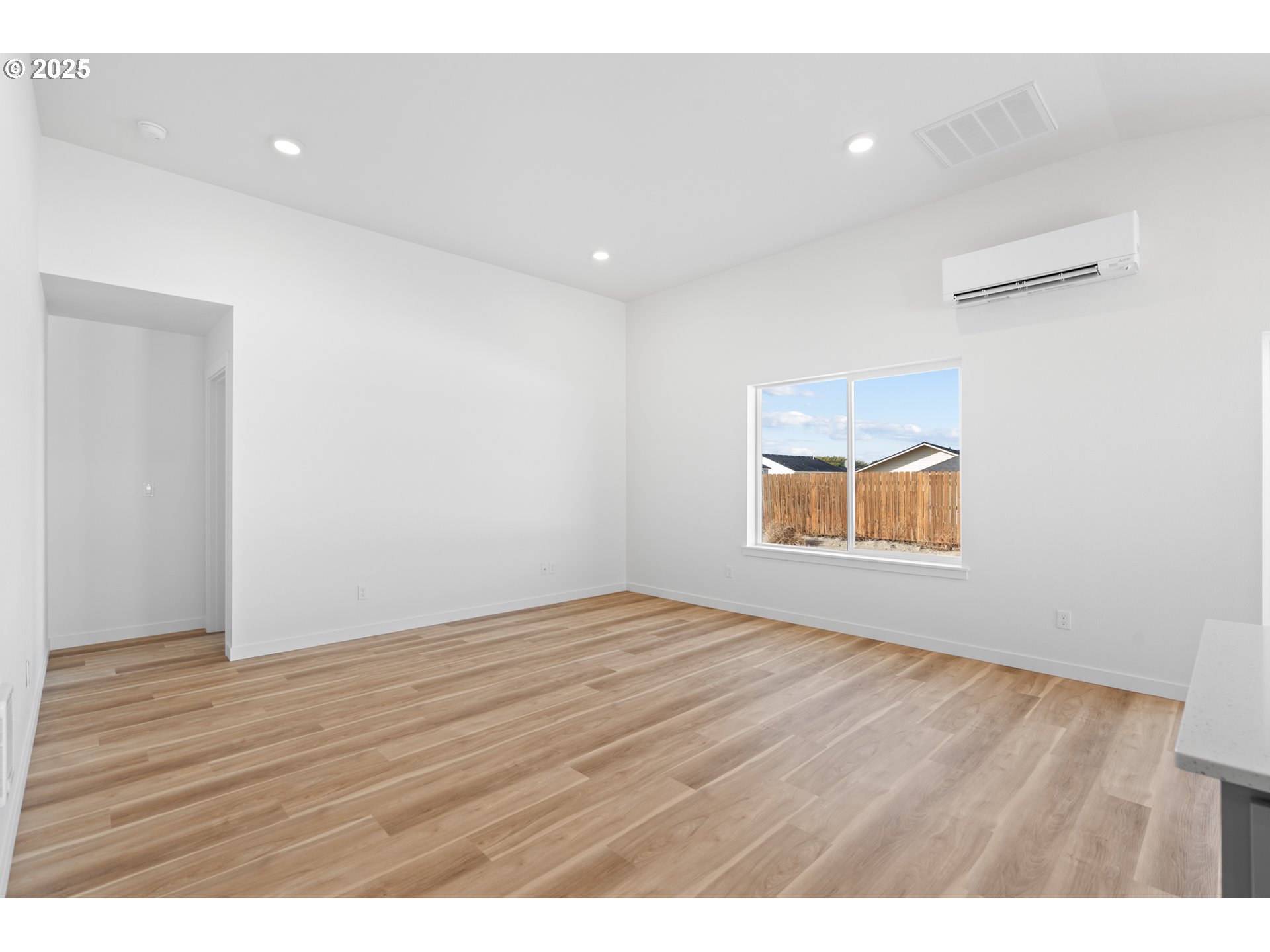 148 Southwest Eagle Drive Boardman, OR 97818 - Photo 25 of 27 a room with wooden floor and window