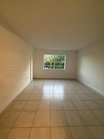a view of a kitchen with a sink and cabinets