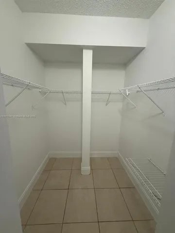 a view of a hallway with staircase