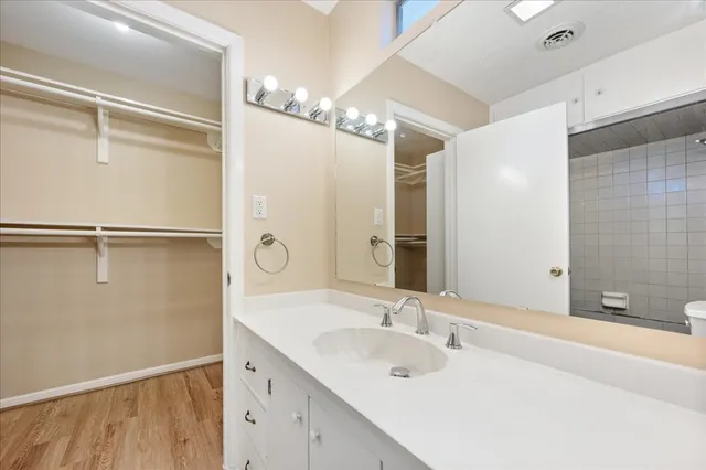 a bathroom with a double vanity sink and mirror
