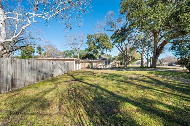 a view of swimming pool with a yard