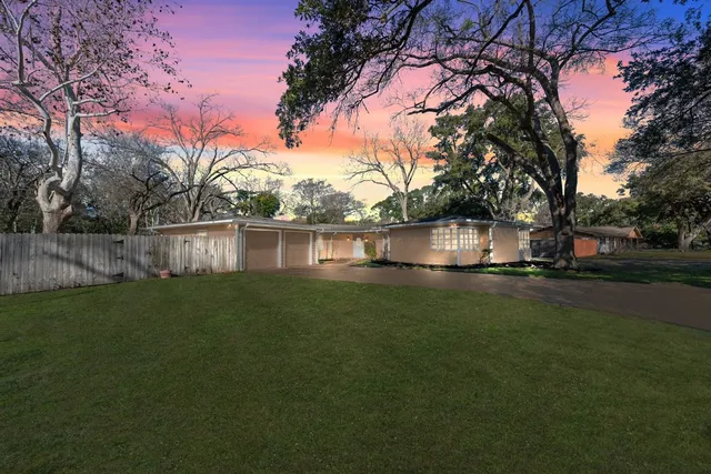 a view of a lake with a house in the background