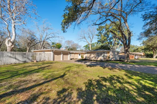 a view of swimming pool with a yard