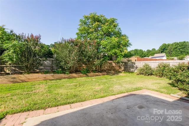 a view of a yard with an outdoor space and seating area