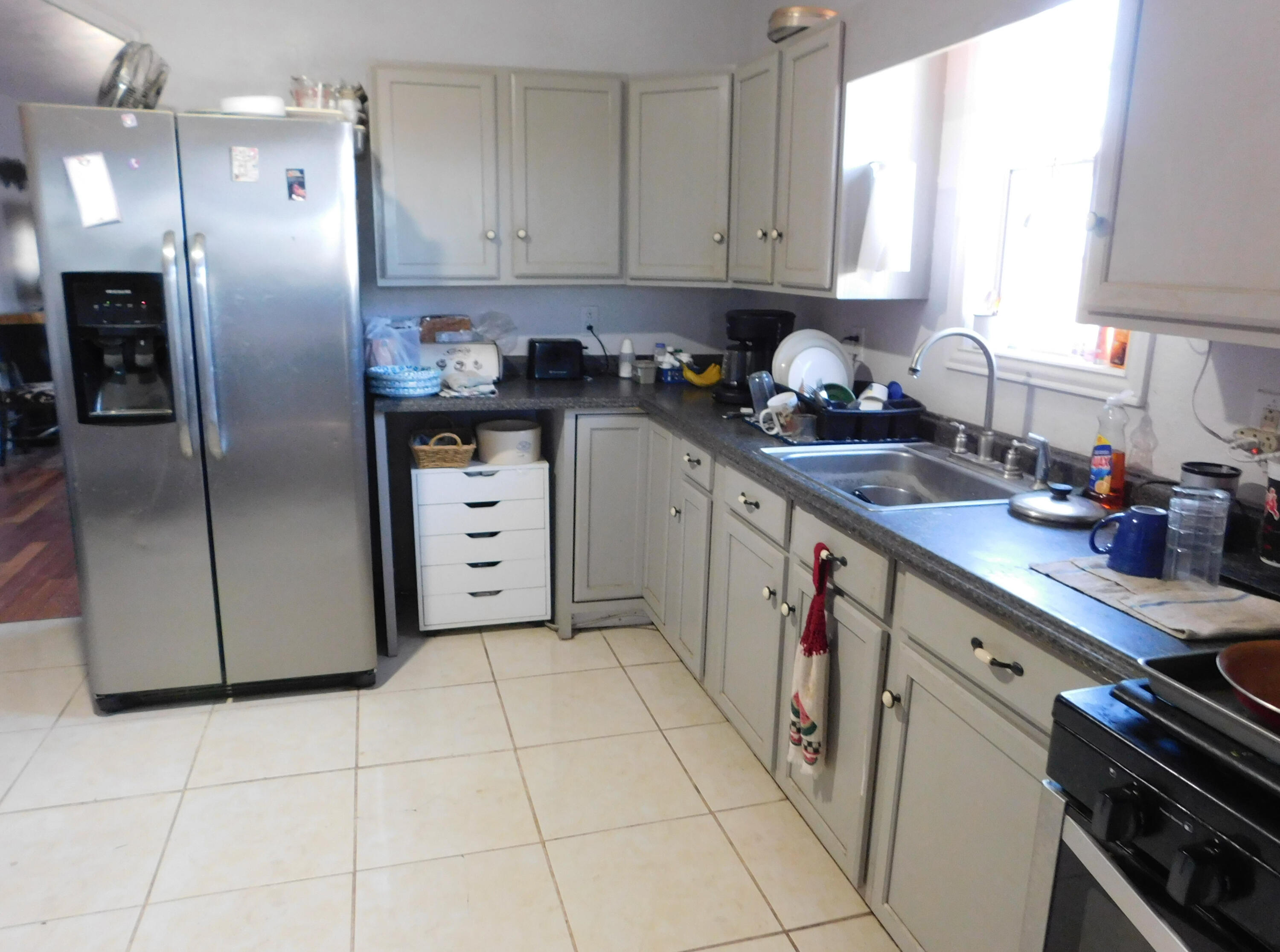 431 County Road 225 Muleshoe, TX 79347 - Photo 7 of 21 a kitchen with stainless steel appliances granite countertop a refrigerator sink and stove